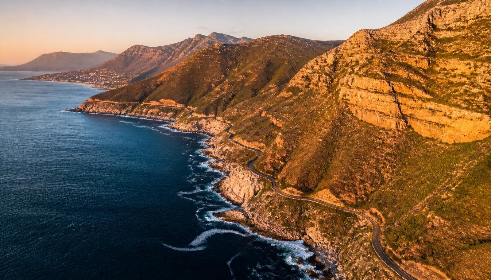 Aerial view of the Cape Peninsula coastline, with cliffs and a winding coastal road above the Atlantic